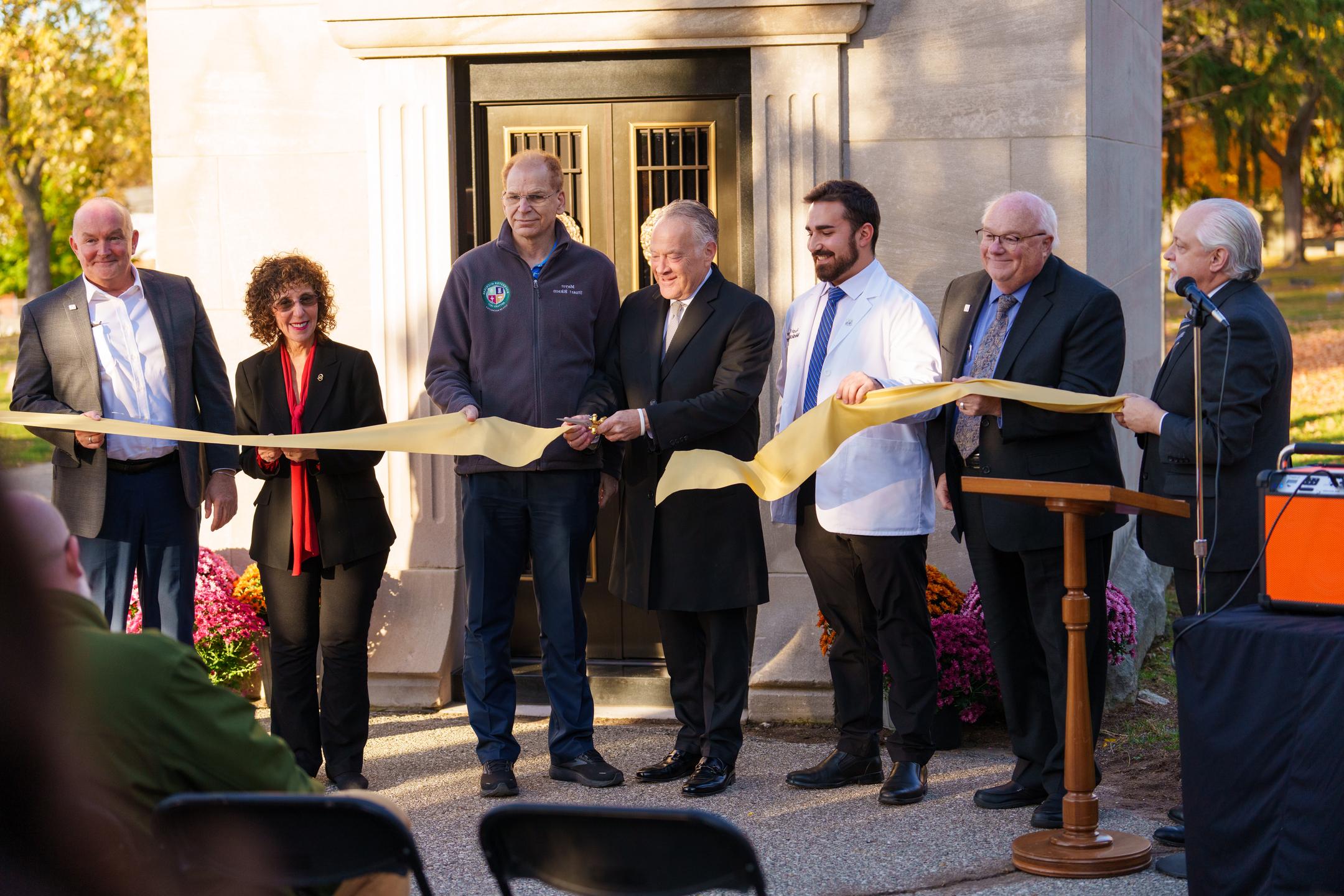 An image of a ribbon being cut in front of the vault
